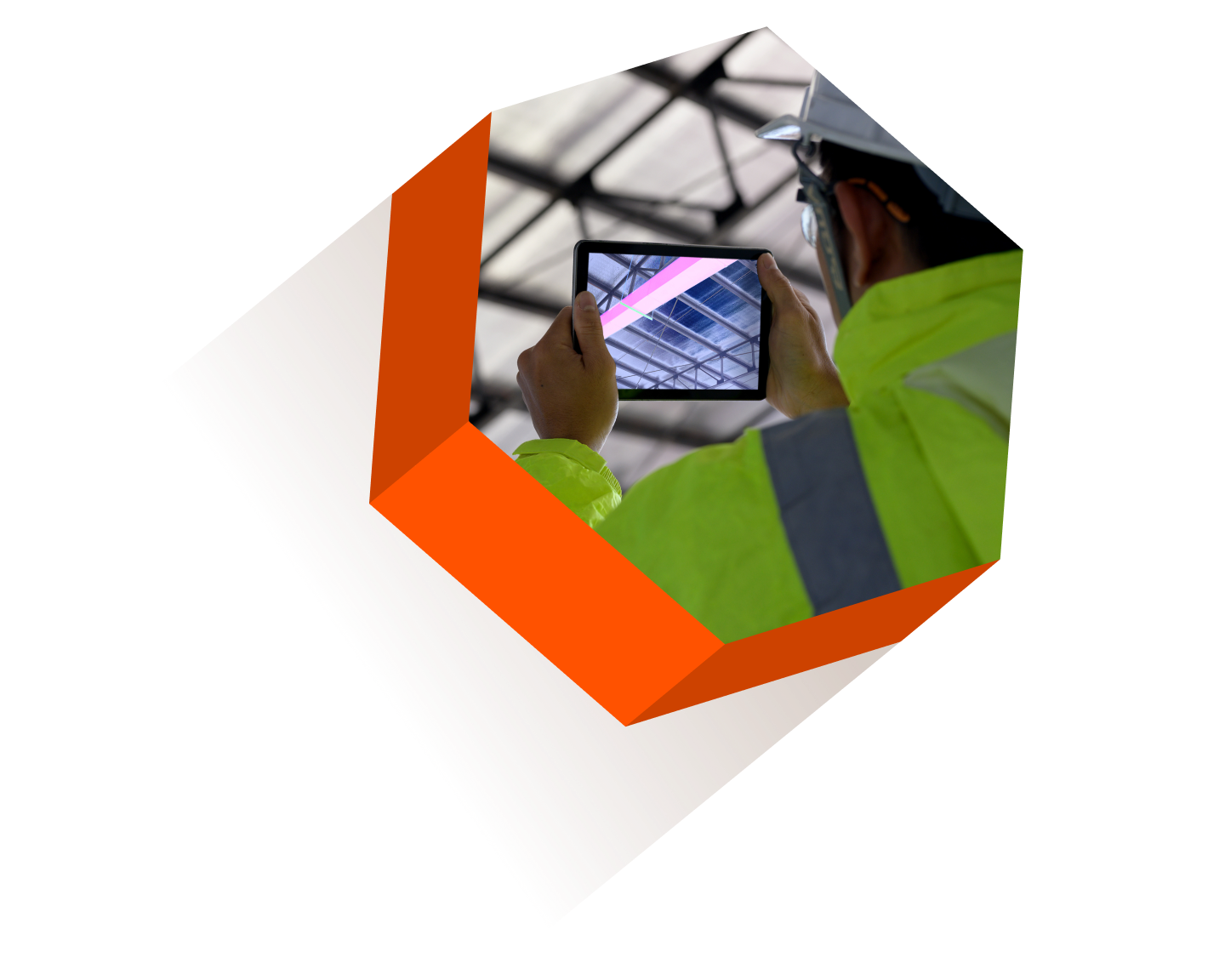 Hexagonal image of a contractor using a tablet to scan a construction site